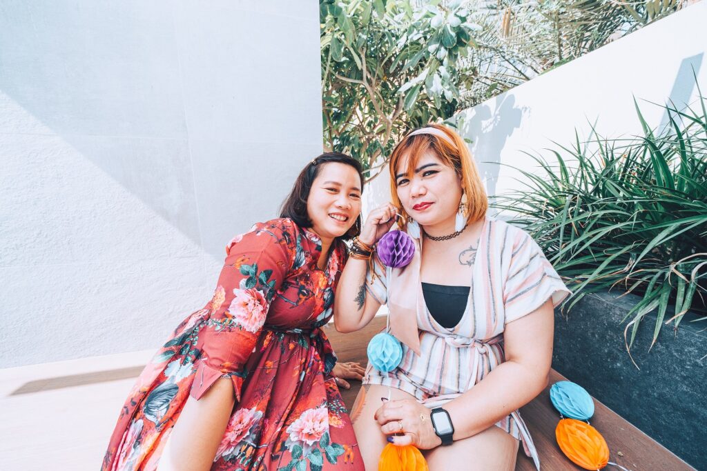 two girls posting for a picture in bohemian theme