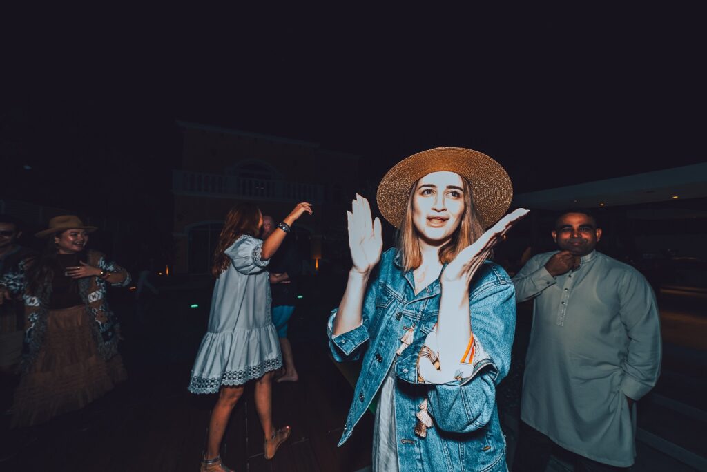 alyona with people dancing in the background