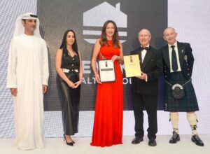 Diana Magariu accepting The International Property Awards 2023 for Key One Realty Group